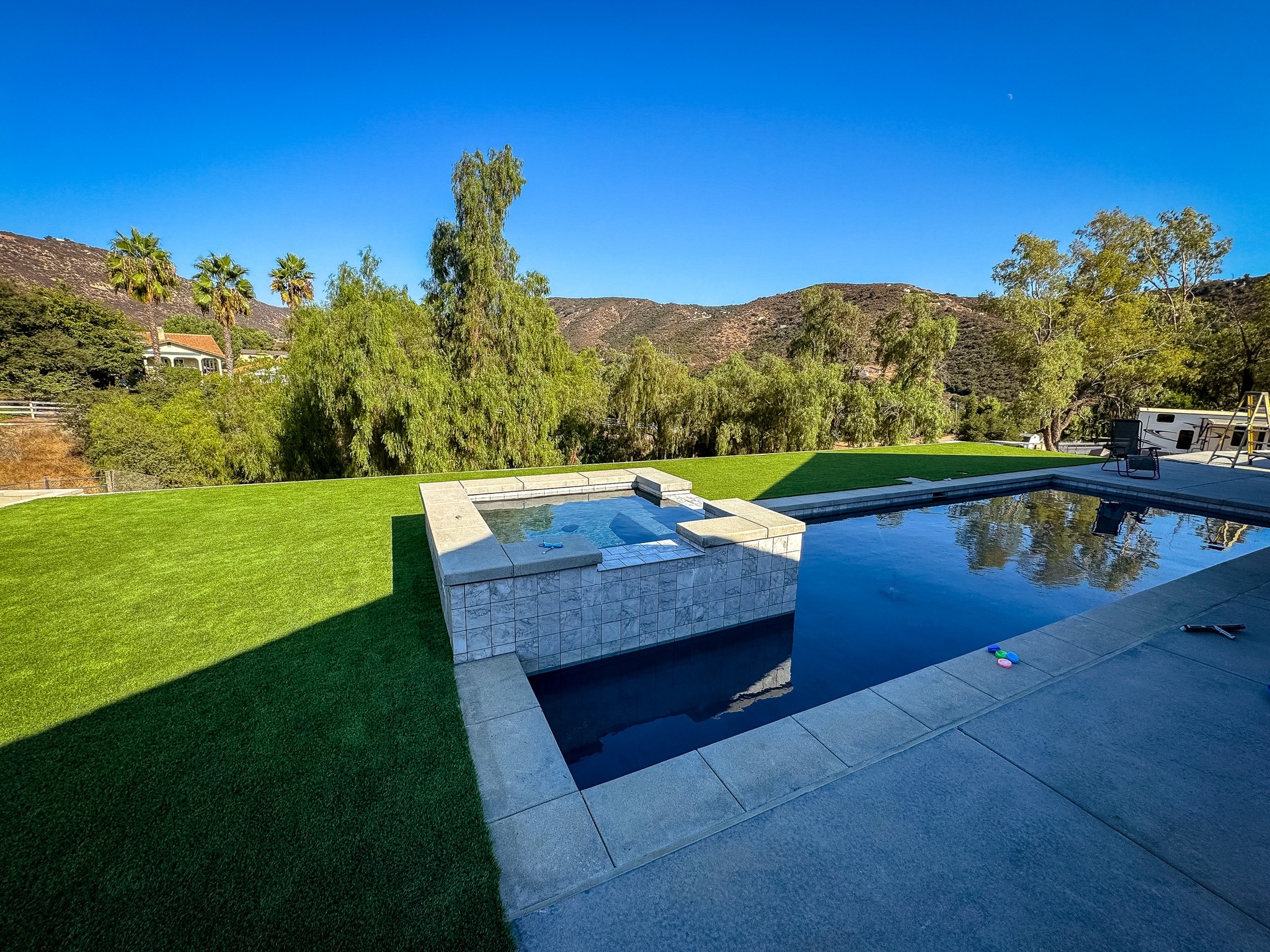 Fresh installed backyard turf & pavers in San Diego, CA
