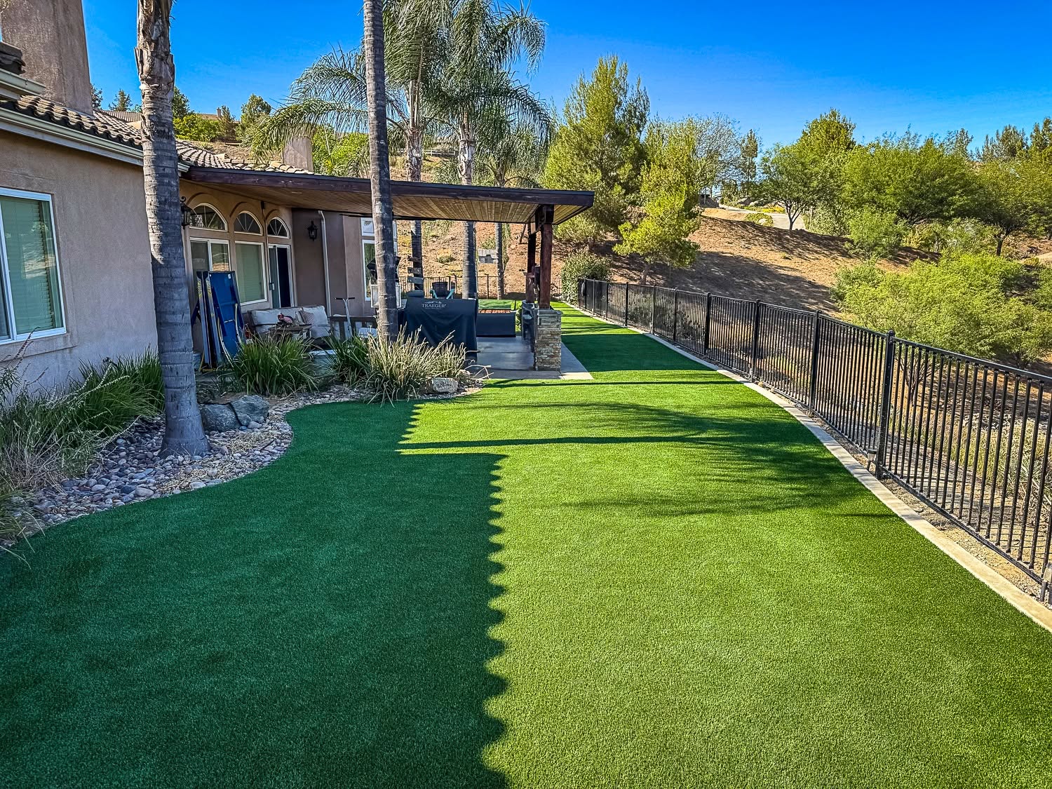 Freshly installed backyard turf & pavers in San Diego, CA